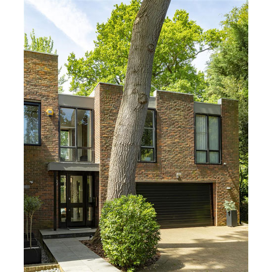 1970s Royston Summers lakeside modernist house in Esher, Surrey