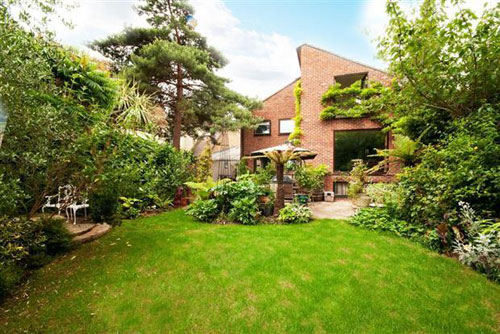 On the market: 1970s architect-designed High Timbers six-bedroomed house in Shepperton, Surrey